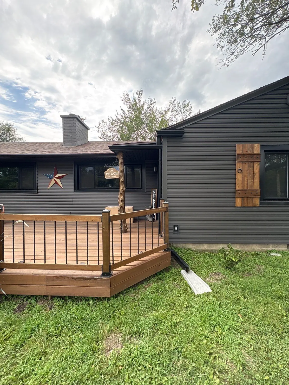 Real black seamless gutter and downspout installation